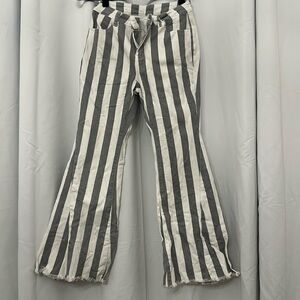 Gray and white striped denim pants with stars on the butt